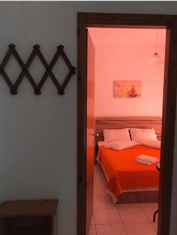 Ένα ή περισσότερα κρεβάτια σε δωμάτιο στο eleni apartments