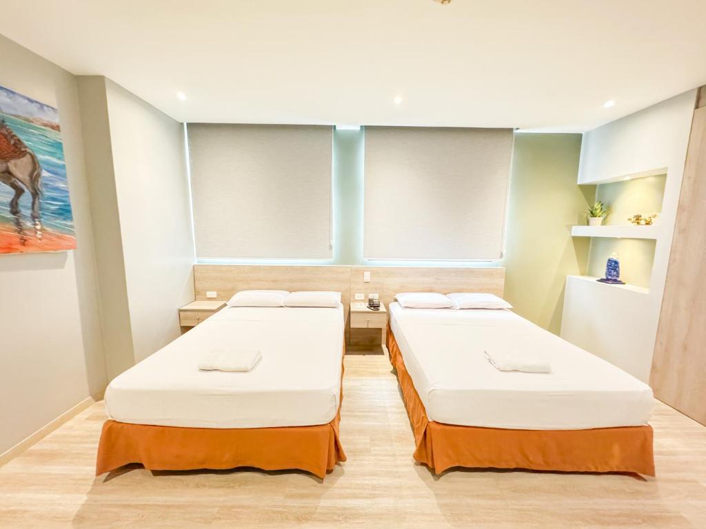 Postel nebo postele na pokoji v ubytování GH Sander Hotel