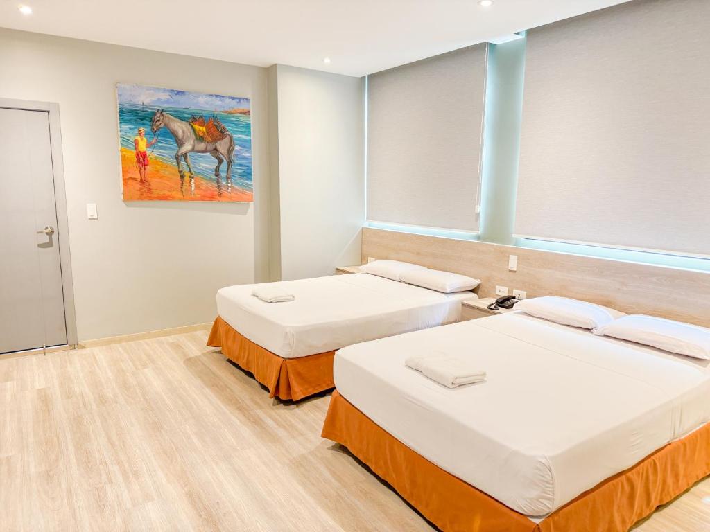 Postel nebo postele na pokoji v ubytování GH Sander Hotel