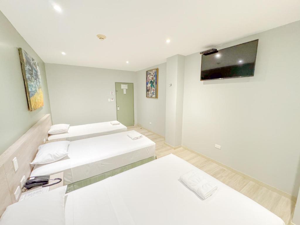 Postel nebo postele na pokoji v ubytování GH Sander Hotel