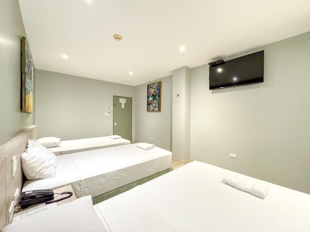 Postel nebo postele na pokoji v ubytování GH Sander Hotel