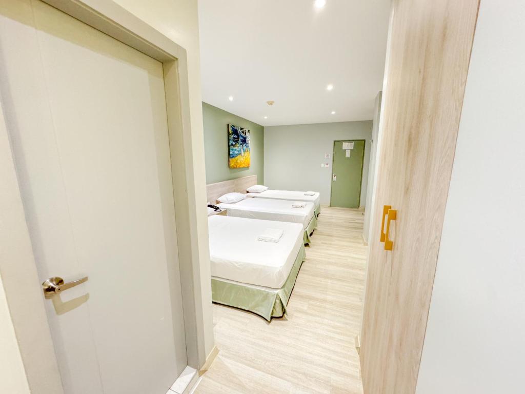 Postel nebo postele na pokoji v ubytování GH Sander Hotel