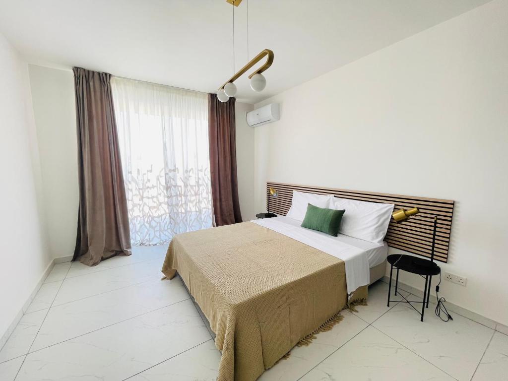 Ένα ή περισσότερα κρεβάτια σε δωμάτιο στο Blu Mar Sea View Apartments