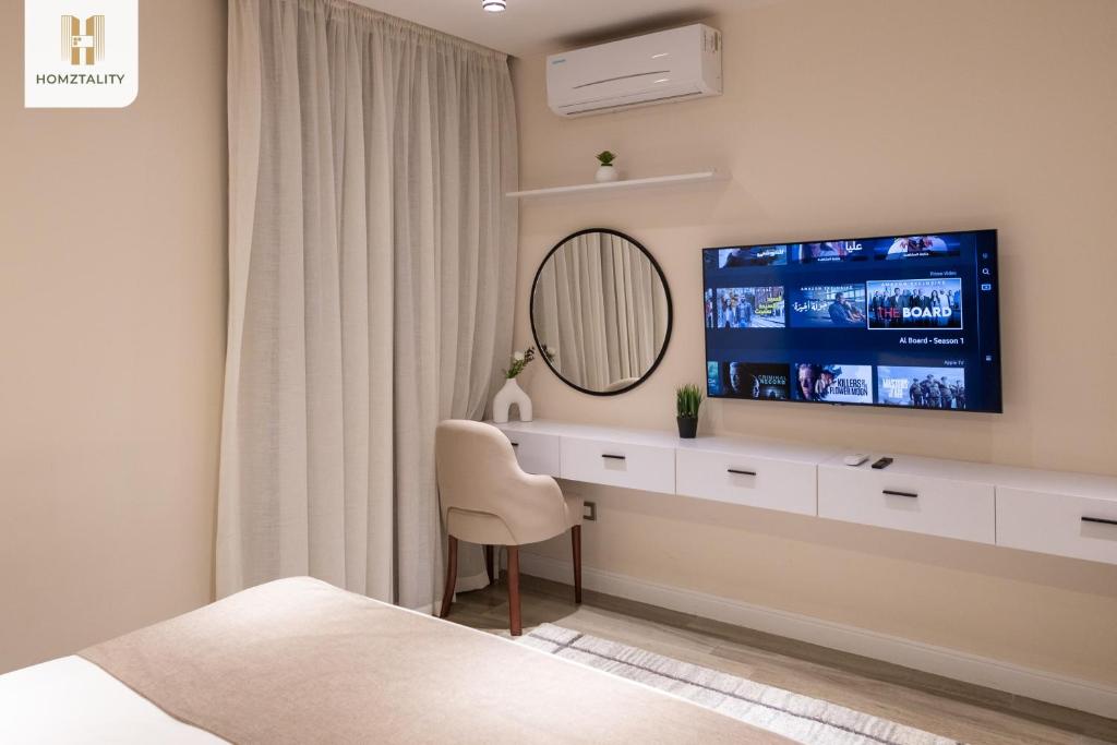 TV a/nebo společenská místnost v ubytování Homztality Elbatal Mohandeseen