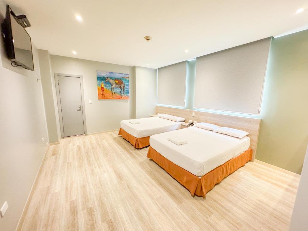 Postel nebo postele na pokoji v ubytování GH Sander Hotel
