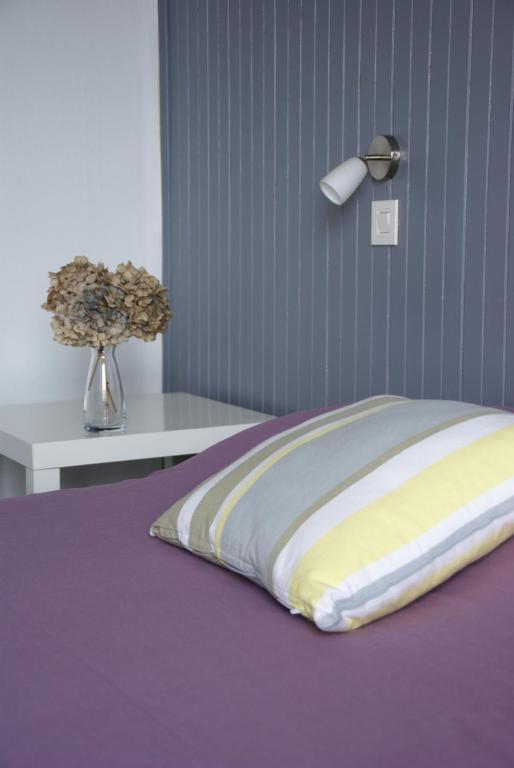 Postel nebo postele na pokoji v ubytování Hôtel Des Deux Mers