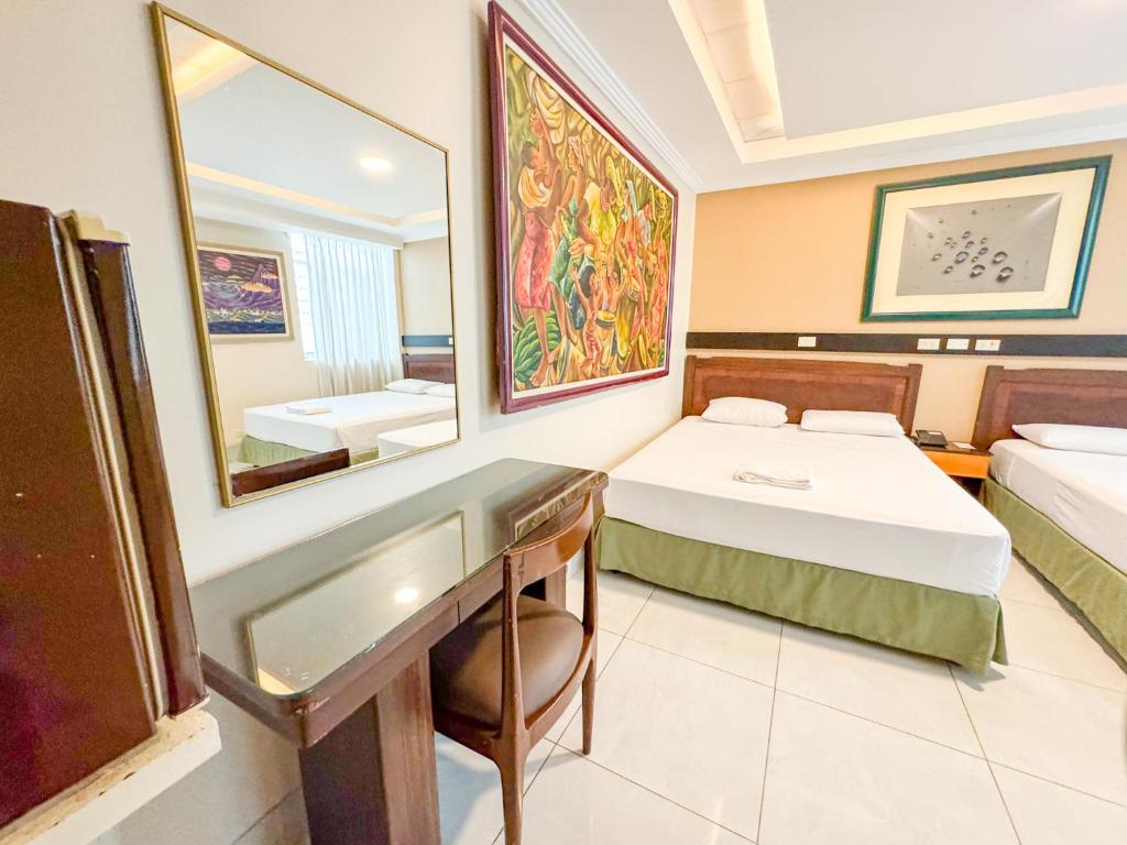 Postel nebo postele na pokoji v ubytování GH Alexander Hotel