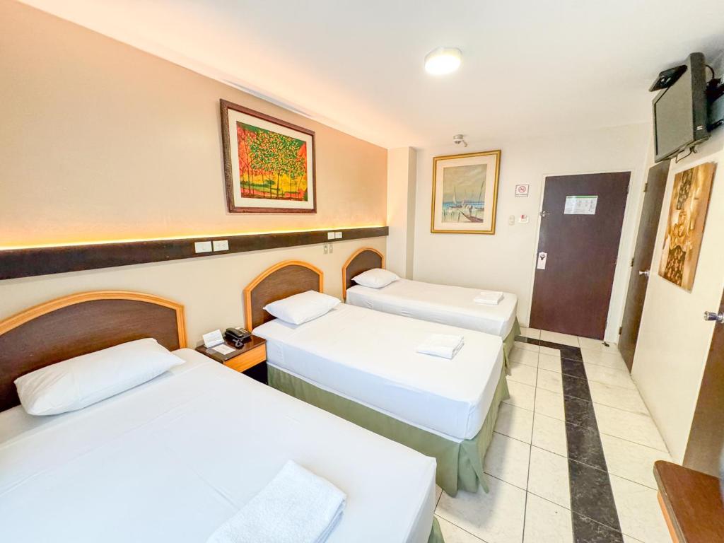 Postel nebo postele na pokoji v ubytování GH Alexander Hotel