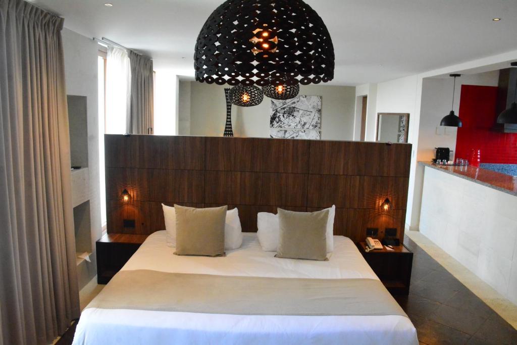 Postel nebo postele na pokoji v ubytování Ilo Rojo Hotel Boutique