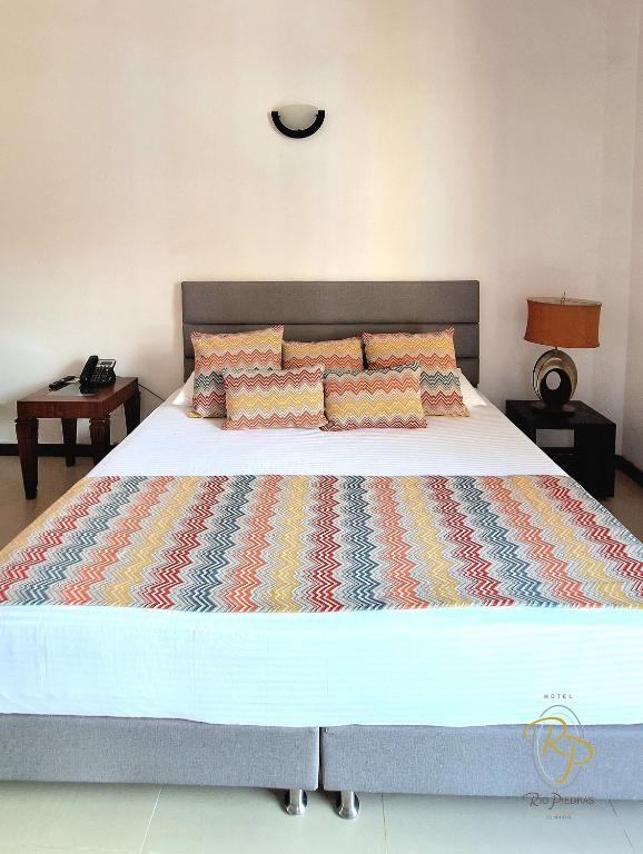 Postel nebo postele na pokoji v ubytování Hotel Rio Piedras