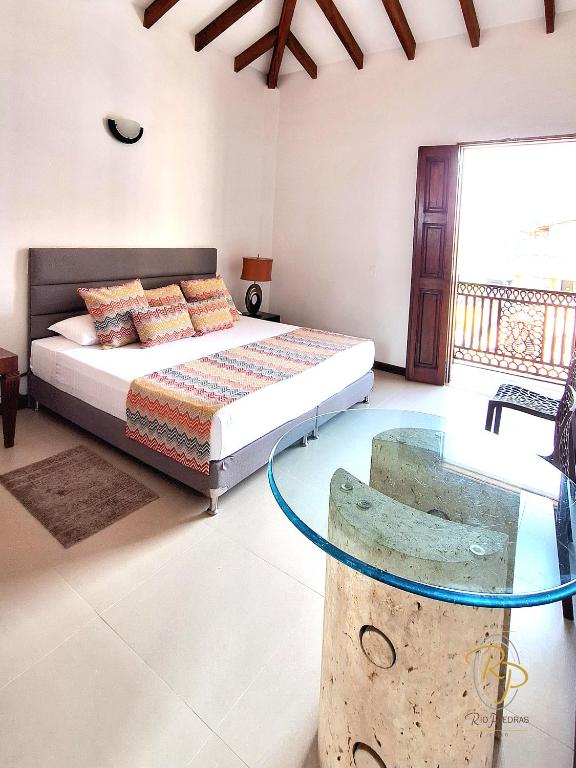 Postel nebo postele na pokoji v ubytování Hotel Rio Piedras