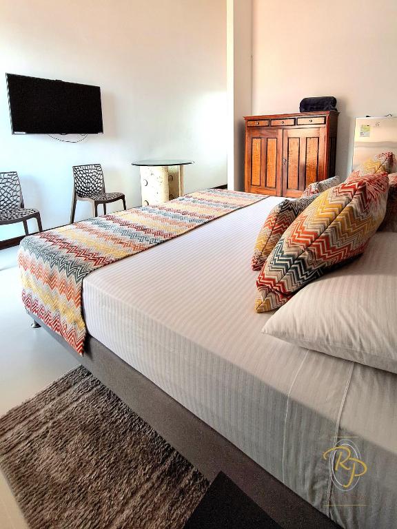 Postel nebo postele na pokoji v ubytování Hotel Rio Piedras