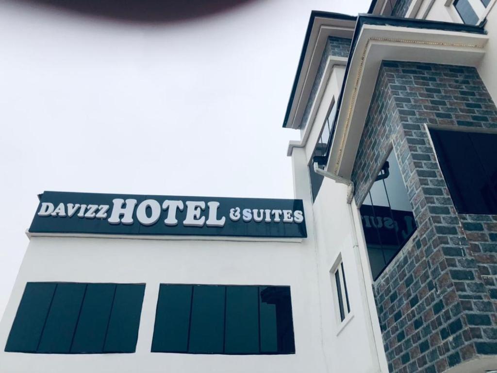 a sign on the side of a building at DAVIZZ HOTEL AND SUITES in Asaba