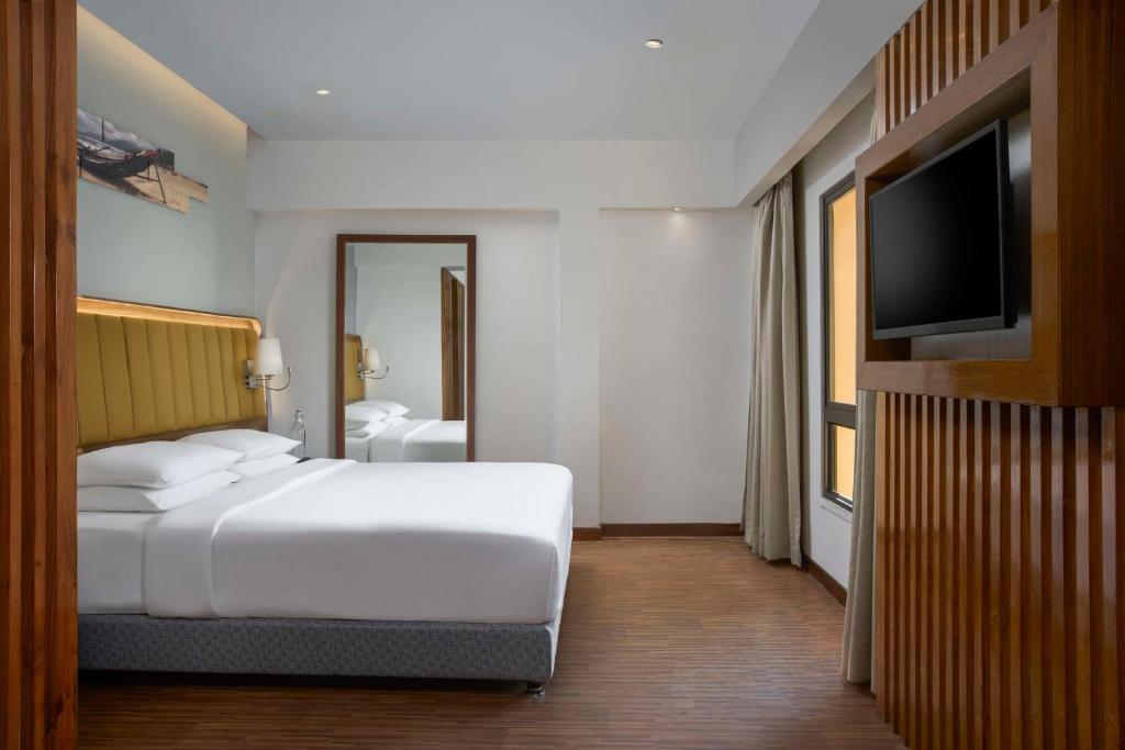 Postel nebo postele na pokoji v ubytování Park Inn by Radisson Goa Candolim