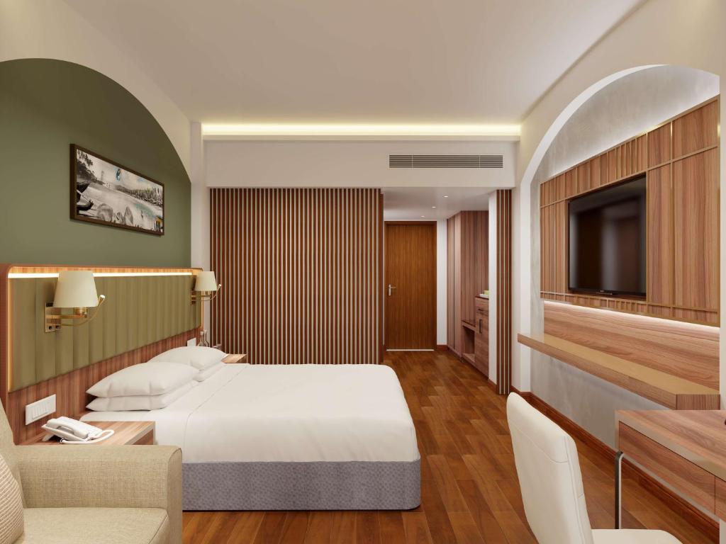 Postel nebo postele na pokoji v ubytování Park Inn by Radisson Goa Candolim