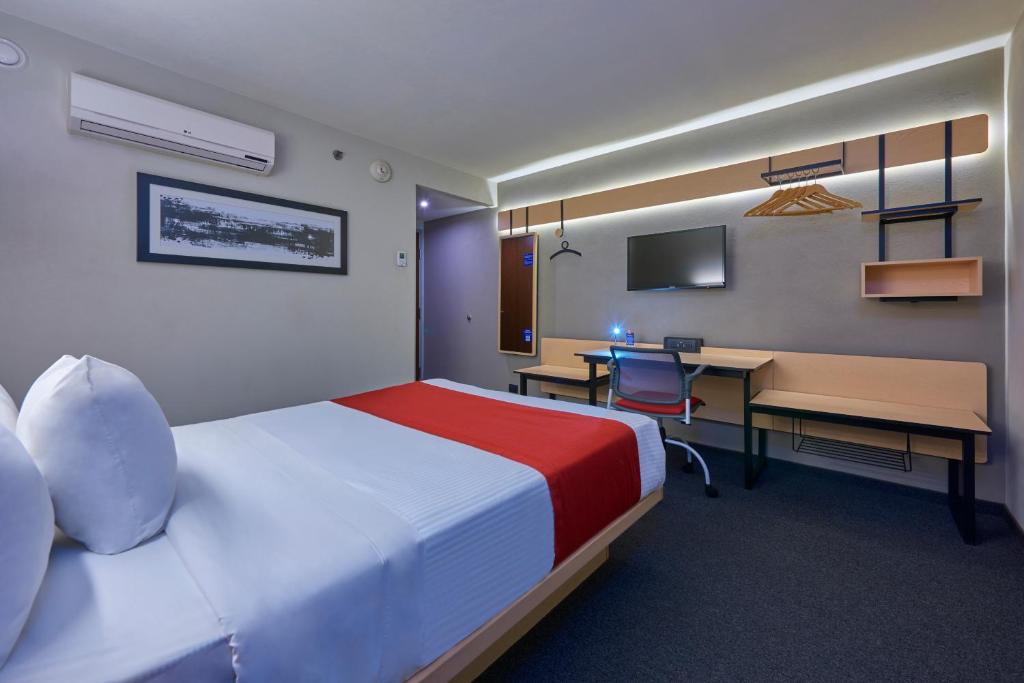 Postel nebo postele na pokoji v ubytování City Express by Marriott Tijuana Rio