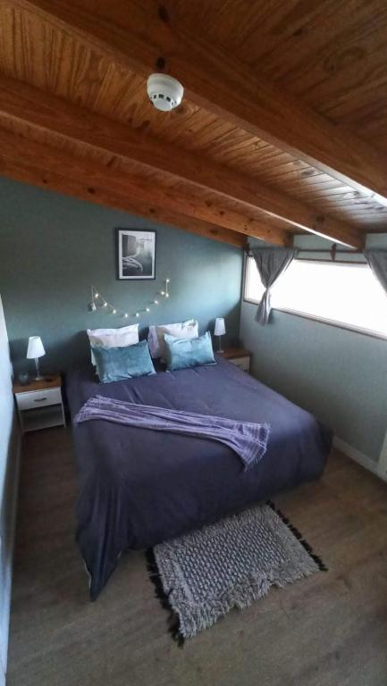 Postel nebo postele na pokoji v ubytování Buenavida Guesthouse