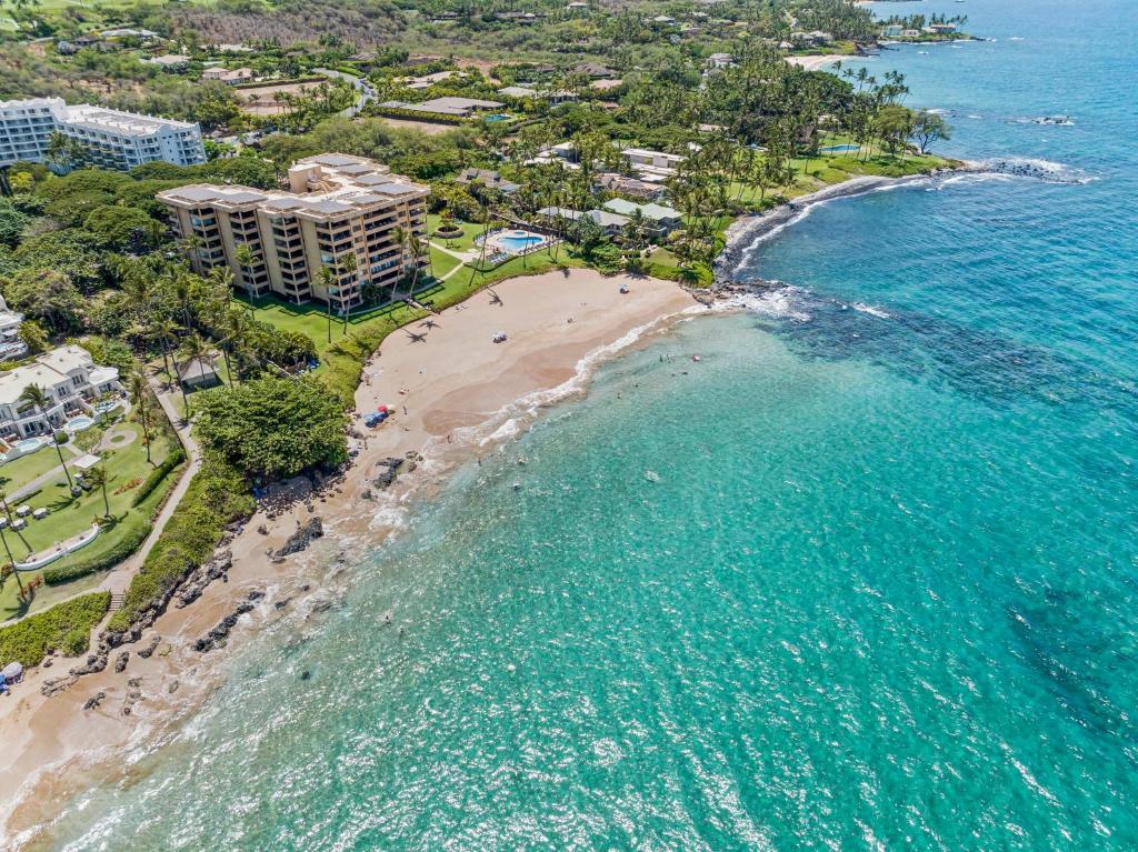 an aerial view of the beach and the ocean at Polo Beach Club - CoralTree Residence Collection in Wailea