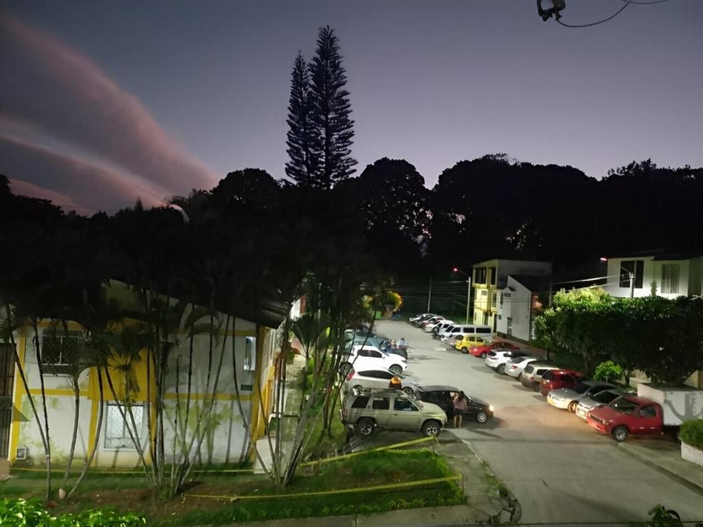 a view of a parking lot with cars parked at BORA - Apto 101Tu espacio fuera de casa in Ibagué