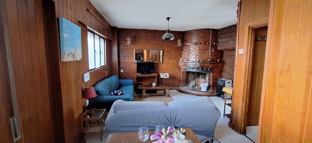 a living room with a couch and a fireplace at Casa Medina albaycin Amazing House for 5pax in Granada