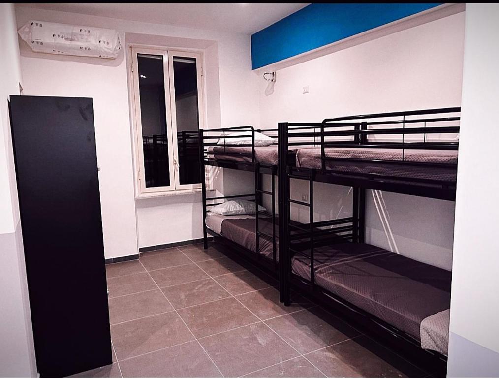 Postel nebo postele na pokoji v ubytování Melting Pot Rome