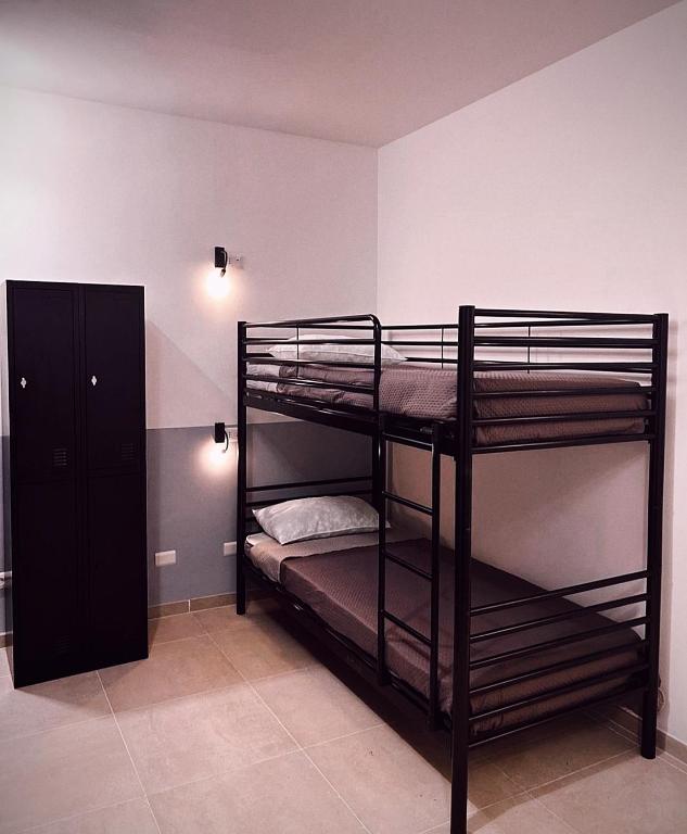 Postel nebo postele na pokoji v ubytování Melting Pot Rome