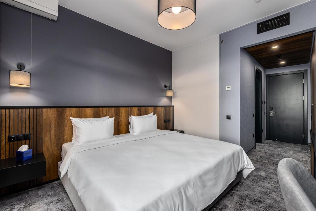 Postel nebo postele na pokoji v ubytování Hotel Qvevrebi