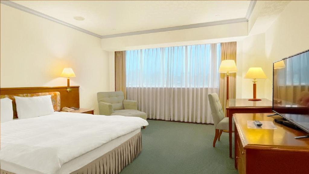 Voodi või voodid majutusasutuse Hotel Avenue toas