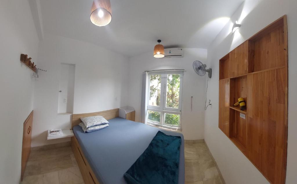 Postel nebo postele na pokoji v ubytování NT House
