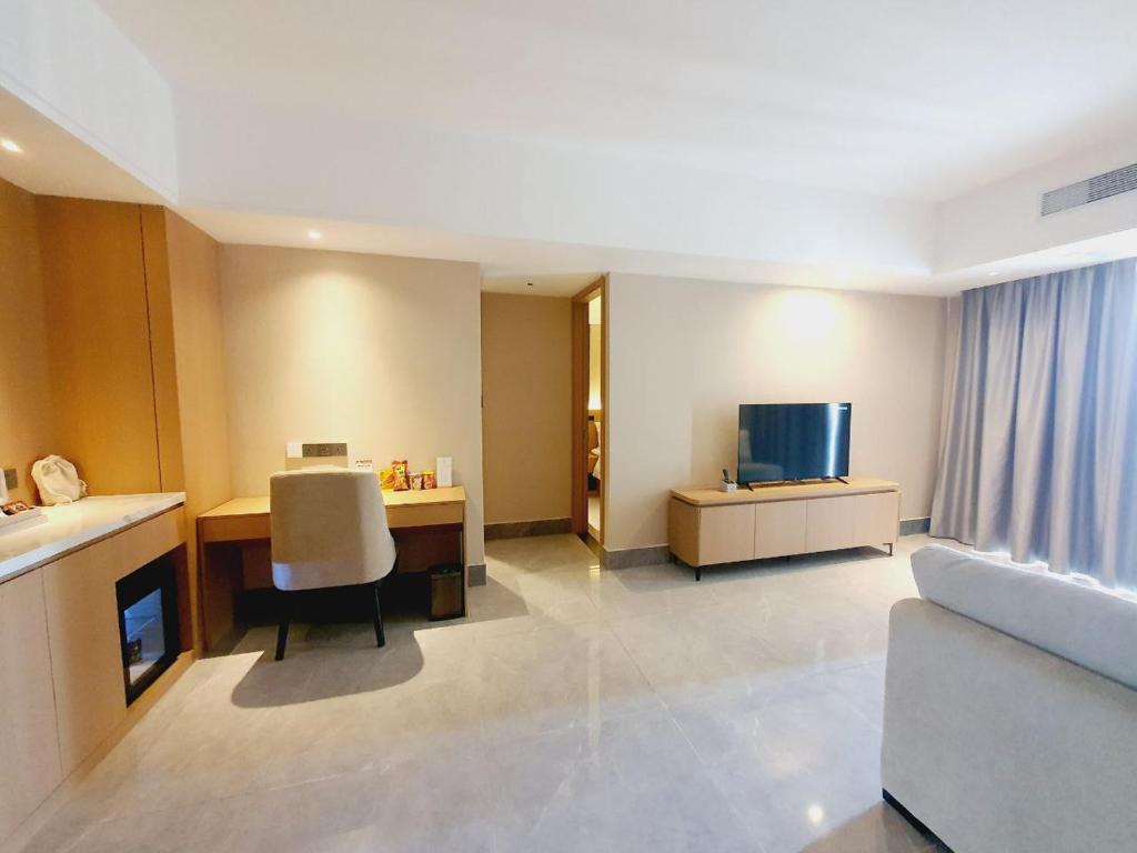 TV a/nebo společenská místnost v ubytování JD POLMAN Hotel