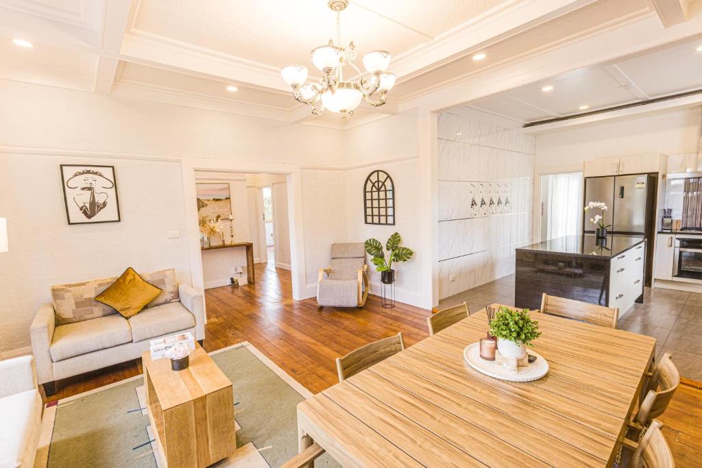 a living room with a table and a couch at Feels like your home ! in Auckland