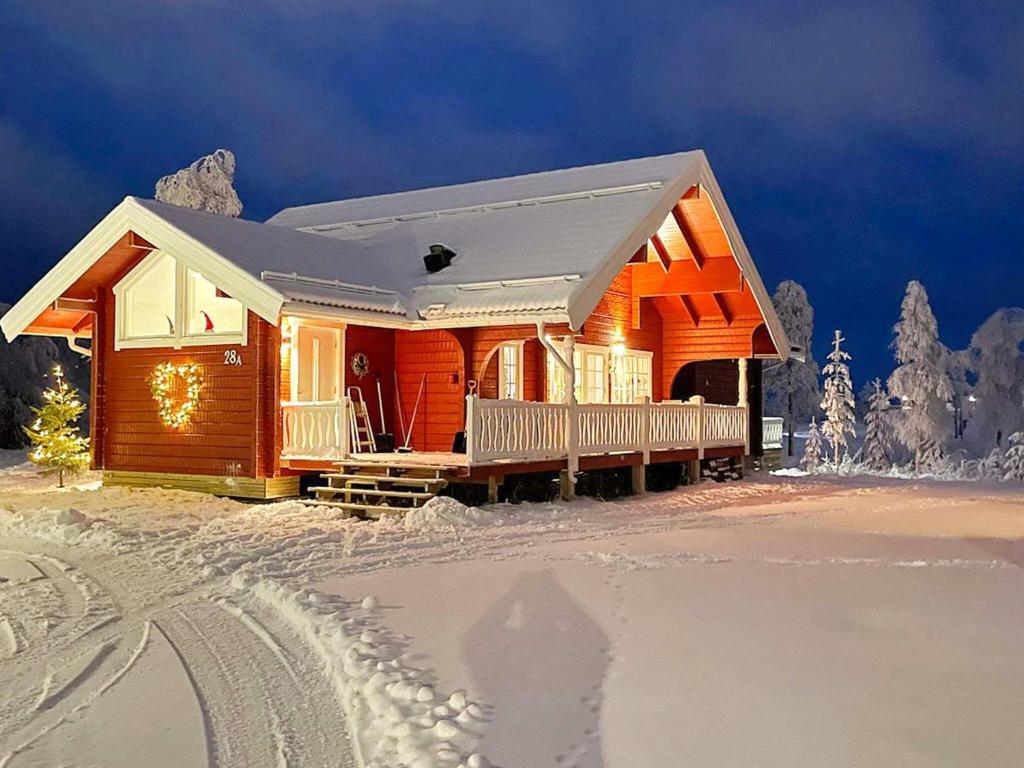a wooden house in the snow with a trail at 10 person holiday home in SYSSLEB CK in Sysslebäck