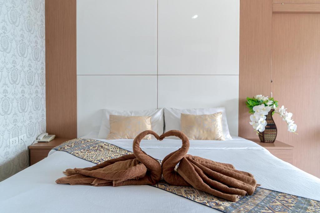 Postel nebo postele na pokoji v ubytování The Infinity Suite Chiangrai