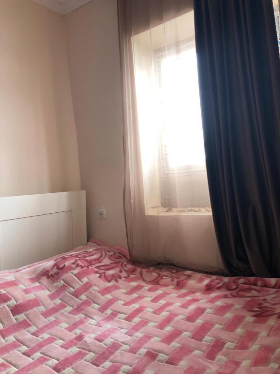 Postel nebo postele na pokoji v ubytování Tsvirmi Zviadi's guesthouse