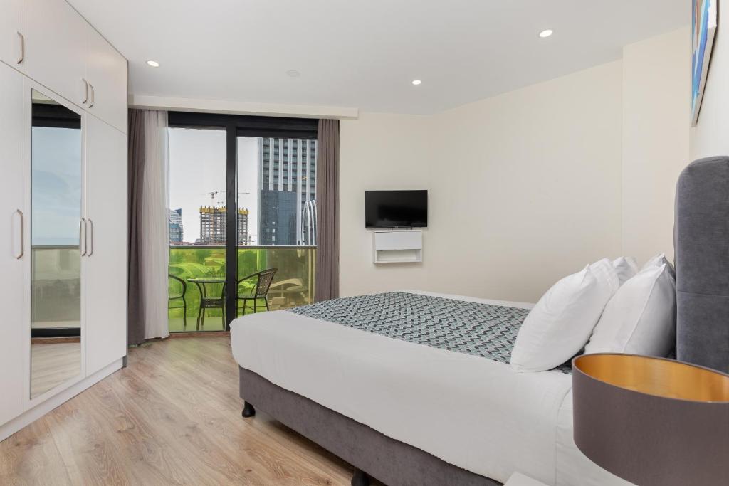 Postel nebo postele na pokoji v ubytování Bellevue Residence Suites