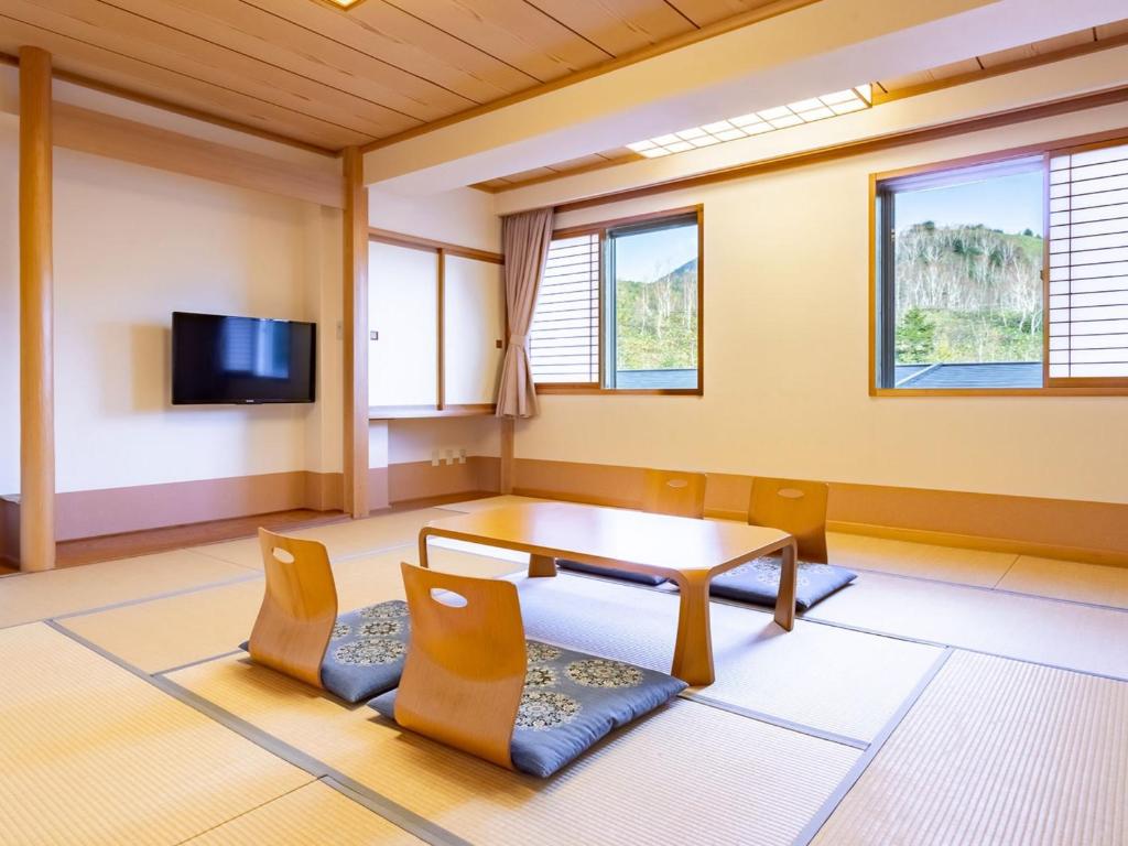 TV a/nebo společenská místnost v ubytování Sachinoyu Hotel Shiga Kogen