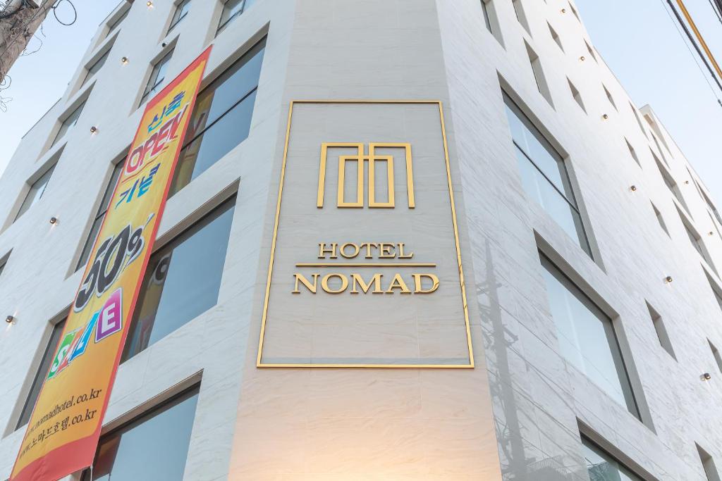 a hotel noord sign on the side of a building at NOMAD HOTEL in Gimhae