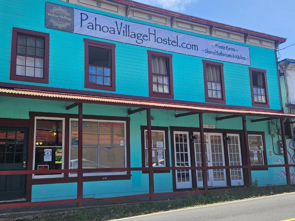 a blue building on the side of a street at Pahoa Village Hostel in Pahoa