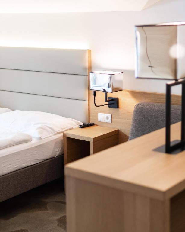Postel nebo postele na pokoji v ubytování Hotel Matteo