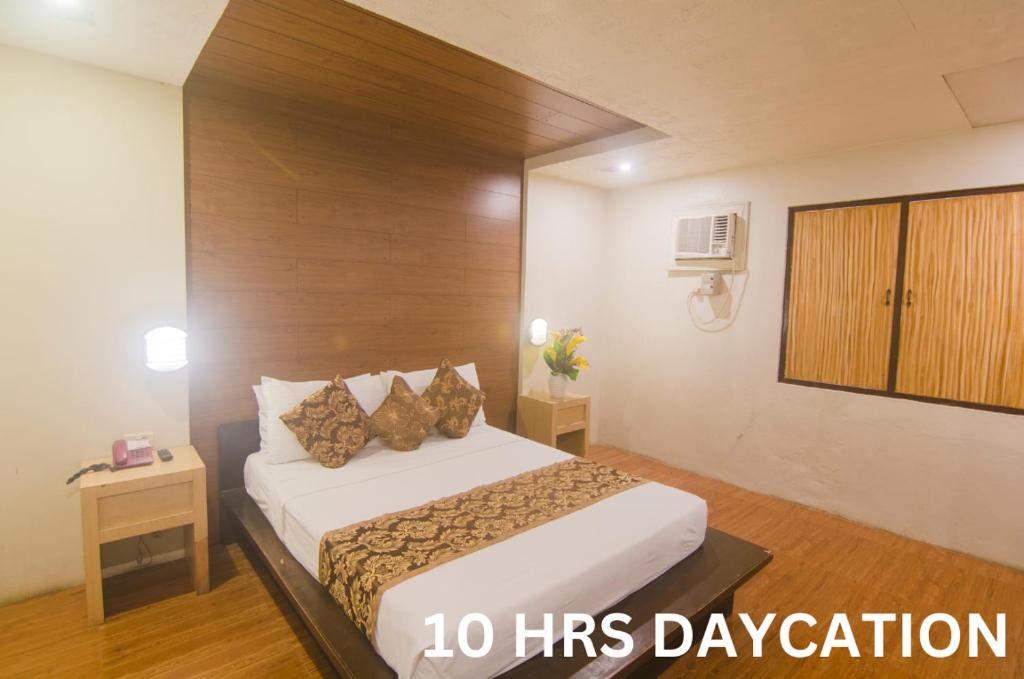 Postel nebo postele na pokoji v ubytování Hotel Carmelita