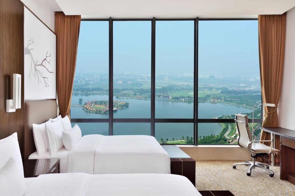 Postel nebo postele na pokoji v ubytování The Westin Kolkata Rajarhat