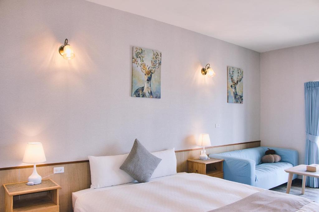 Postel nebo postele na pokoji v ubytování Loju Seaview Homestay