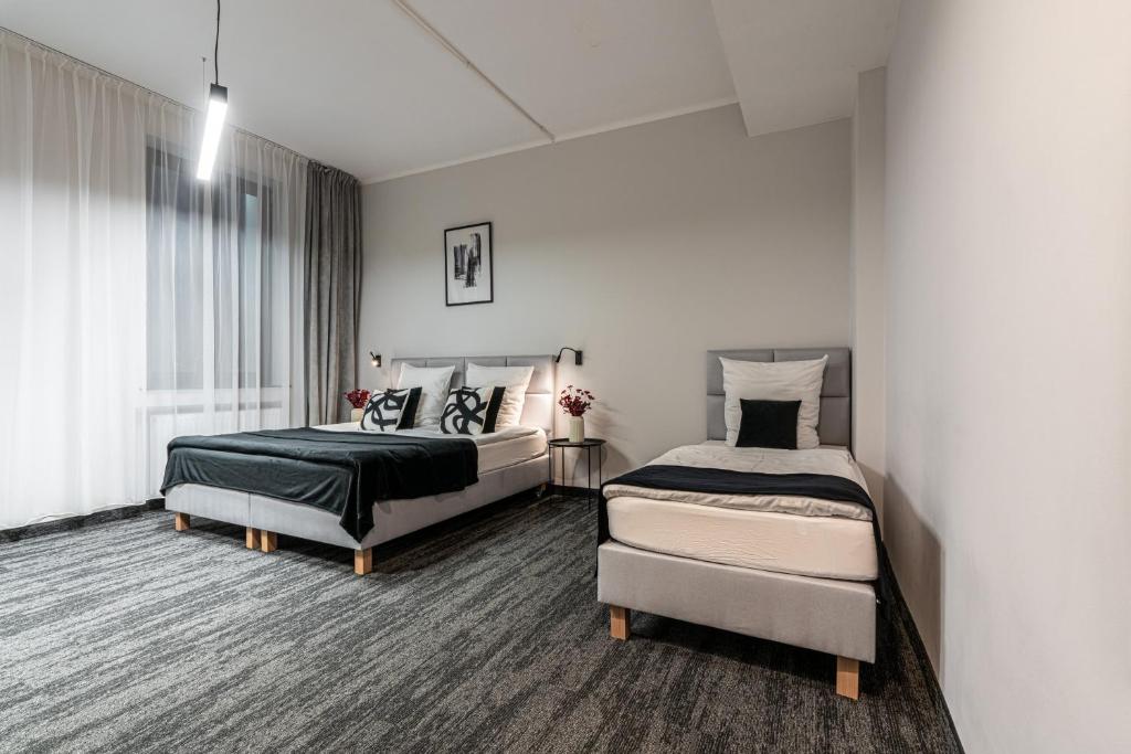 Posteľ alebo postele v izbe v ubytovaní VANTA Business Center