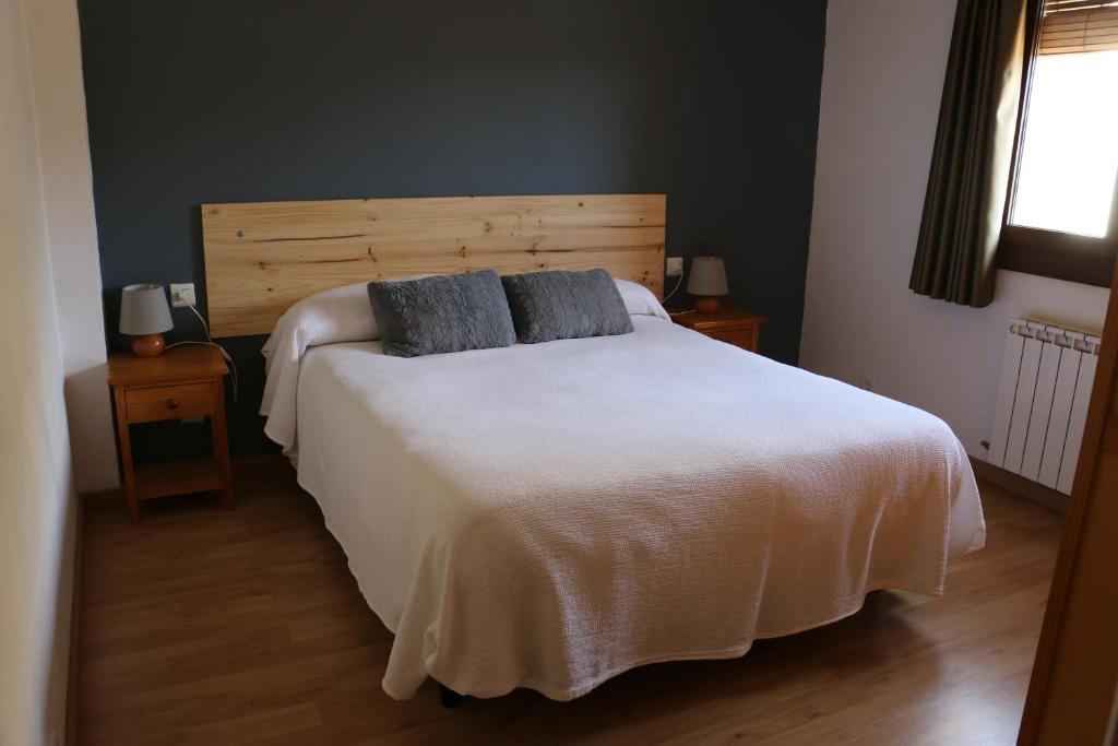 Postel nebo postele na pokoji v ubytování Hotel Balcó del Priorat