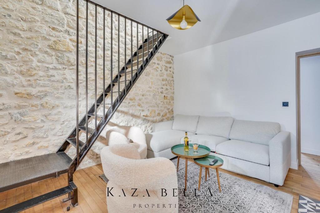 a living room with a couch and a table at KAZA BELLA - Maisons Alfort 8 Modern large apartment in Maisons-Alfort