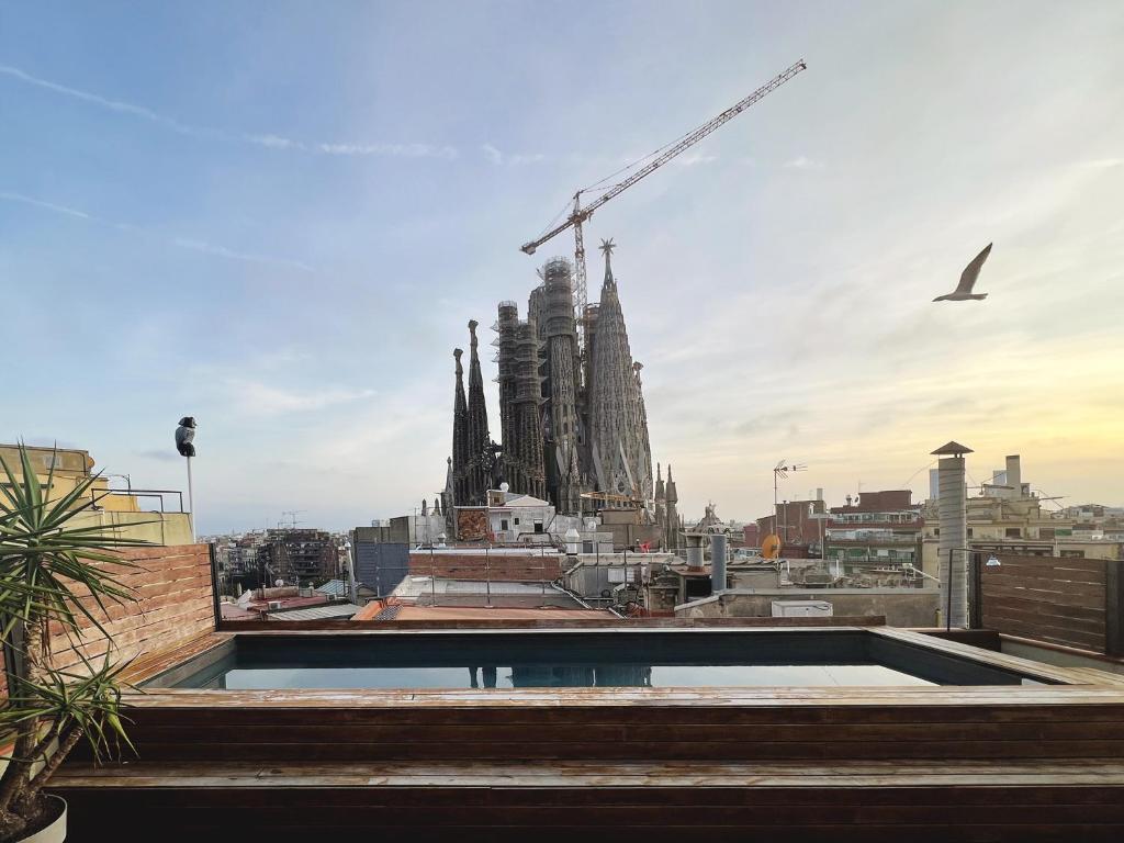 a view of a building under construction with a crane at Enjoybcn Gaudi Apartments in Barcelona