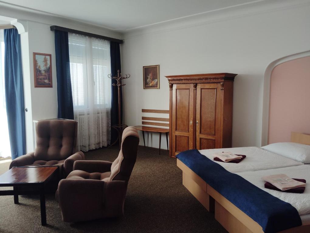 Postel nebo postele na pokoji v ubytování Hotel Lux
