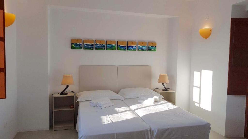 Postel nebo postele na pokoji v ubytování Villa Patmos Netia - Location Xoxlakas