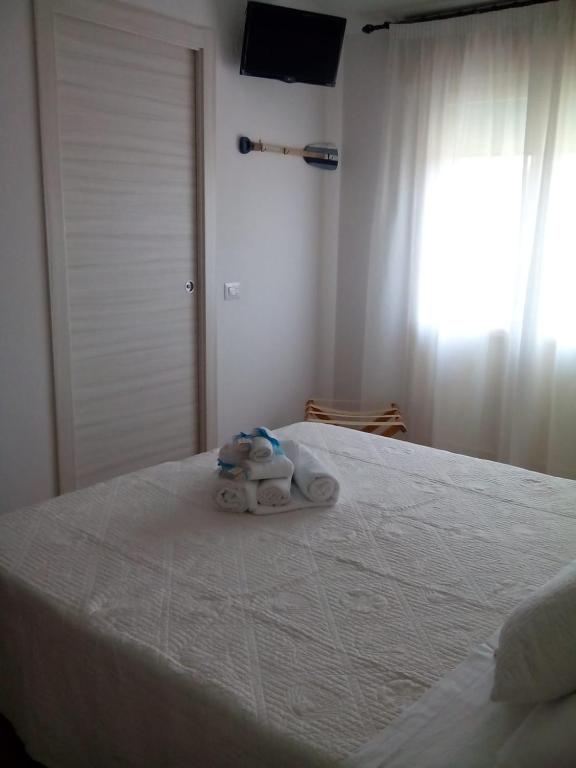 Postel nebo postele na pokoji v ubytování Albergo Medusa