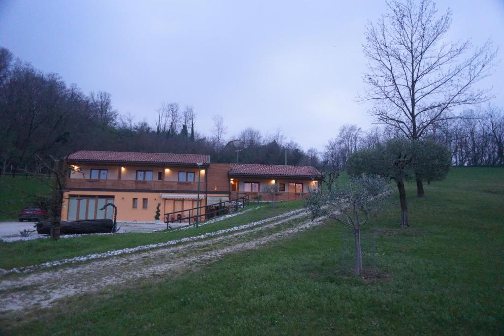 a large house in the middle of a field at Nikolas' Valley in Cornuda